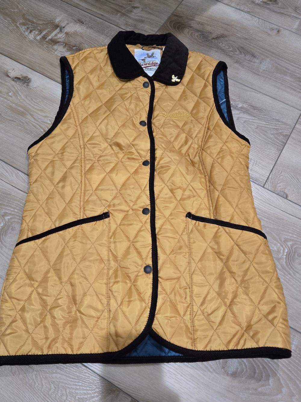 John Partridge Quilted Mustard Sleeveless Vest with Brown Trim